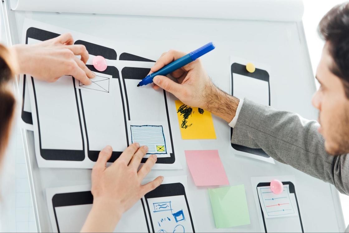 Man writes on diagram of phone